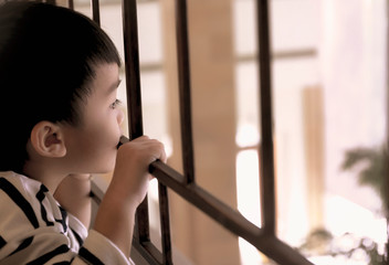 portrait of cute asian lonely young boy