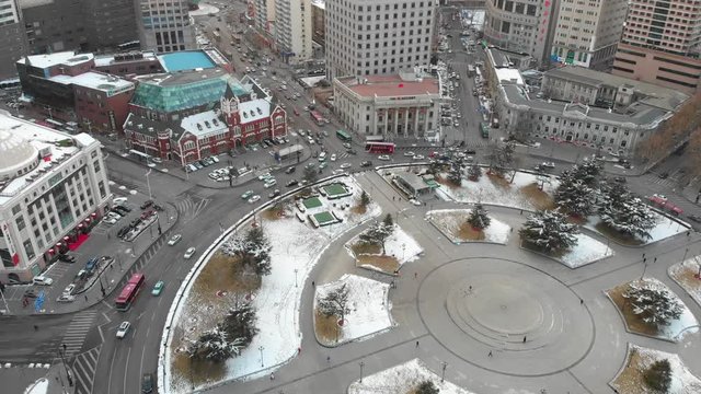 Drone aerial shot of roundabout with cars and busses in Dalian. Popular tourist destination in China, Liaoning Province. 