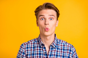 Close up photo amazing youngster he him his man excited look wondered lips mouth perfect ideal o shape figure form wear casual plaid checkered shirt outfit isolated yellow bright background