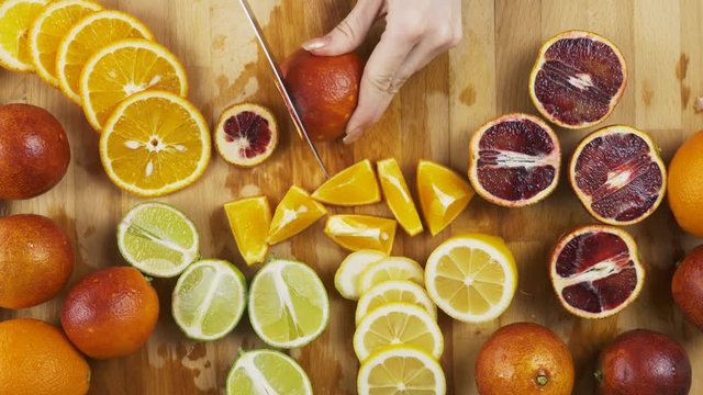 Cutting Variety of citrus fruit including lemons, lines, grapefruits and oranges.