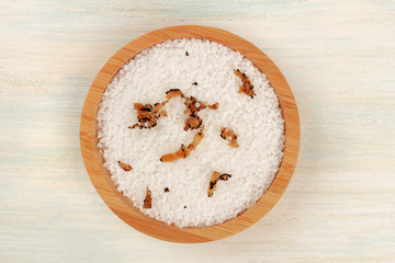 A bowl of sea salt infused with truffle shavings, shot from the top