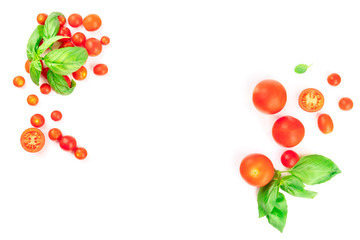 Fresh basil leaves and cherry tomatoes, shot from the top on a white background, forming a frame for copy space