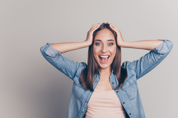 Portrait of funky cute astonished teen teenager touch hand head shout yell wonder hear incredible information bargain impressed dressed fashionable clothing isolated silver background