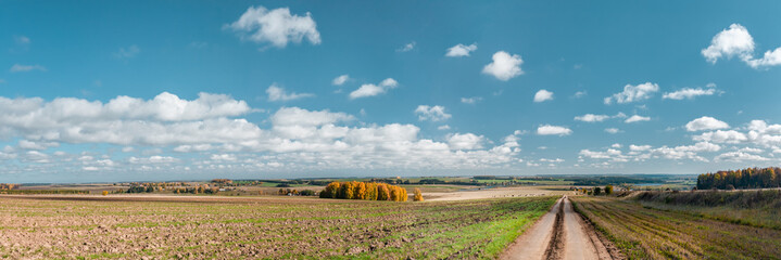 The dirt road to villegae at the field, a panorama from several frames, Mari El, Russia