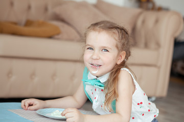 happy pretty little girl at birthday party, indoor