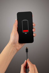 Elegant hand charging cellphone with low battery
