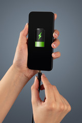Elegant hand charging cellphone with low battery
