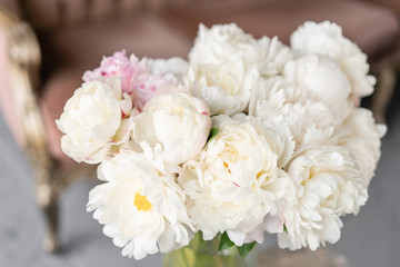 White peonies in a metal vase. Beautiful peony flower for catalog or online store. Floral shop concept . Beautiful fresh cut bouquet. Flowers delivery