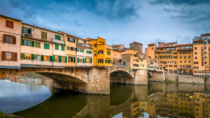 Fototapeta na wymiar Ponte Vecchio bridge spans the Arno River in Florence, Italy