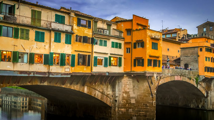 Fototapeta na wymiar Ponte Vecchio bridge spans the Arno River in Florence, Italy