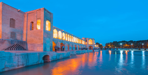 Unidentified Iranian family resting in the ancient Khaju Bridge, (Pol-e Khaju) -Isfahan, Iran