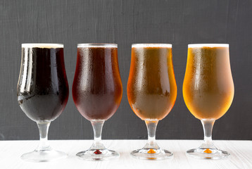 Cold craft beer assortment, side view. Close-up.
