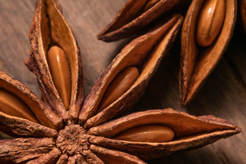Star anise or badian close up on wooden table