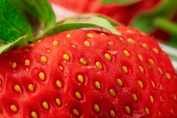 Closeup of strawberries with a pronounced texture of the peel surface