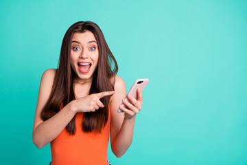 Portrait cute funky astonished lady impressed unbelievable unexpected incredible notification advice choose decide feedback singlet tank-top orange long hairdo stylish trendy isolated teal background