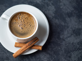 White coffee Cup and chicken slices on stone dark background