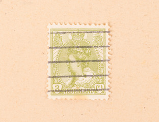 THE NETHERLANDS 1950: A stamp printed in the Netherlands shows the queen, circa 1950