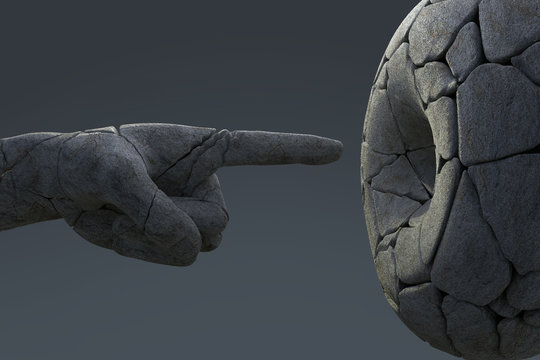 broken arm of a monument points into a hole