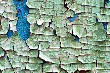 Old blue painted wooden wall texture. Peeling paint on wall background.