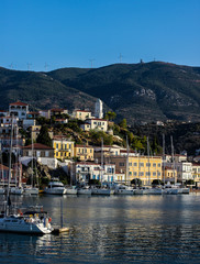 View to the marina of Poros town with yachts and clock tower, Poros island, Saronic islands, Greece 