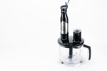 Blender with accessory on the white matt background with copy space