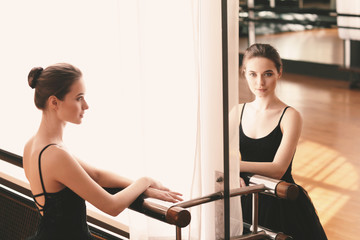 Beautiful young ballerina in dance studio