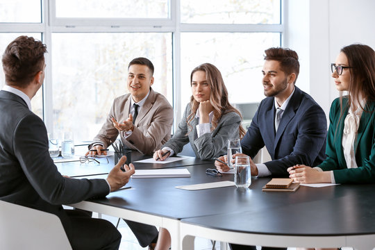 Human resources commission interviewing man in office