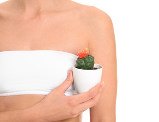 Beautiful young woman with cactus on white background. Depilation concept