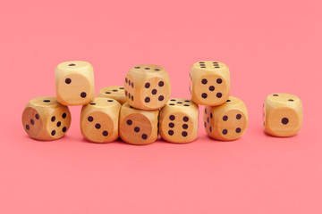 Gaming dice on pink background. Concept for games.