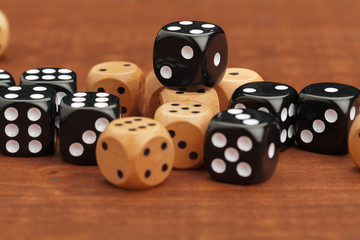 Dice on a wooden table. Concept for business risk.