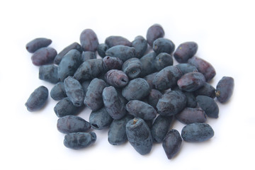 Many Blueberries isolated on white background. Lonicera Caerulea Kamtschatica fruits on white