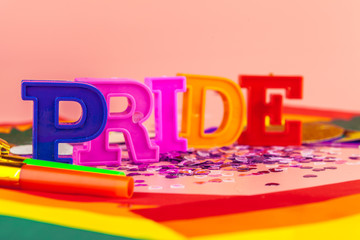 text pride, with lgbt rainbow flag