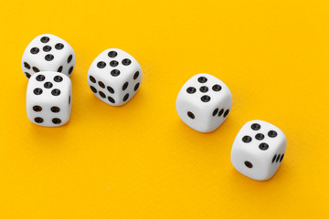dice on a yellow background