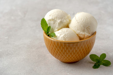 Vanilla ice cream in a bowl on  table