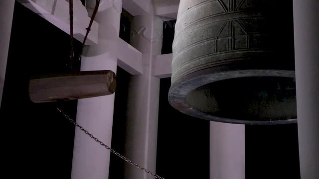 Japanese standing bell ringing at night