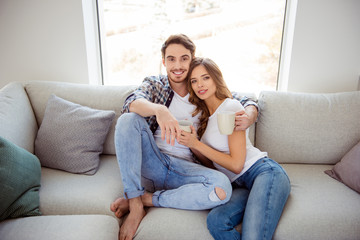 Obraz premium Portrait of her she his he nice-looking adorable attractive lovely charming cute sweet lovable cheerful cheery guy lady sitting on divan in light white style interior living room house
