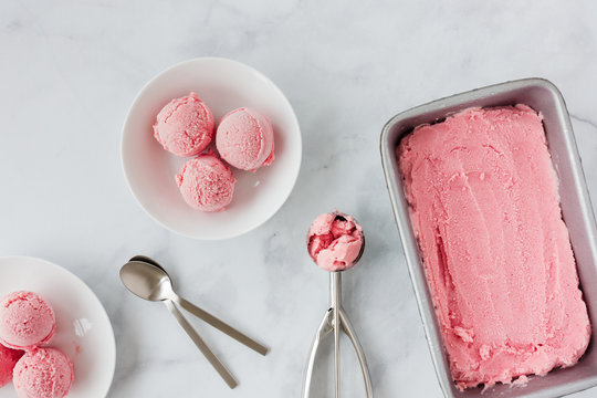 Still Life of Homemade Forced Rhubarb Ice Cream on White Marble