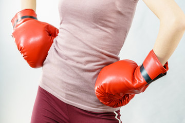 Woman wearing boxing gloves