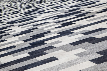 Background of paving slabs, black and white stripes diagonally