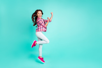 Fototapeta na wymiar Full length body size view photo positive cheerful lady aims luck celebrate competition fan free time travel raise fists shout yeah long haircut checked shirt trendy stylish isolated teal background