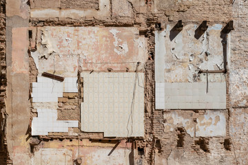 Texture in a wall of a demolished building in Spain. .  Old wall with tiles and another reminders...