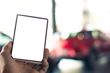 man holding white mock up passport on car blurred bokeh background e-shopping marketing digital, consumer purchase shopping internet online image