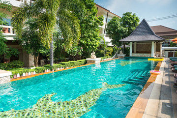 Fototapeta na wymiar beautiful swimming pool in tropical resort , Phangan island, Thailand.