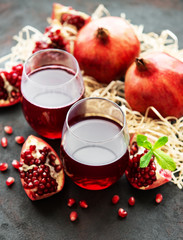 Pomegranate juice with fresh pomegranate fruits