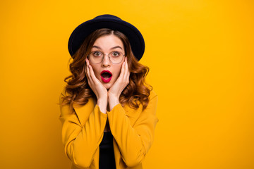 Close-up portrait of nice charming cute attractive lovely chic glamorous terrified frightened wavy-haired lady wearing yellow blazer showing amazement isolated on bright vivid shine orange background