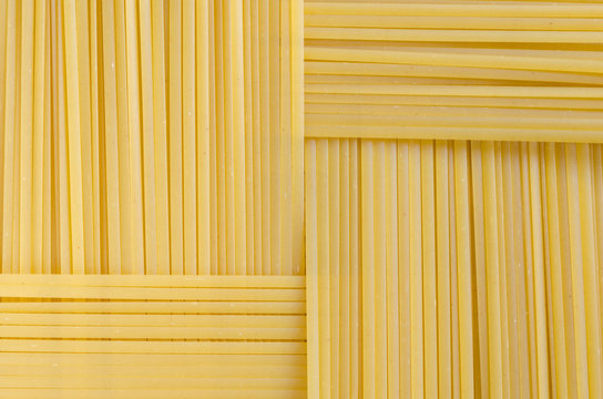 Rectangular geometric pattern of pasta bavette. bavette. Background image of pasta from durum wheat.