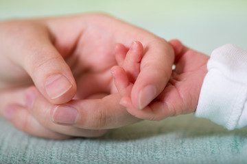Baby and mom hand friendship care tenderness concept. Newborn  new family