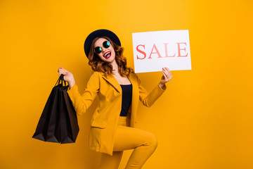Close up side profile photo beautiful she her lady recommend black friday packs paper promo low prices buy buyer sale discount wear specs formal-wear costume suit isolated yellow bright background