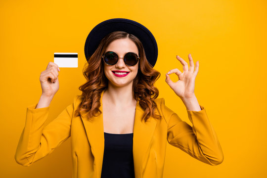 Close up photo beautiful she her lady hands arms credit plastic card show okey symbol advising vacation traveler buyer sale discount wear specs formal-wear suit isolated yellow bright background