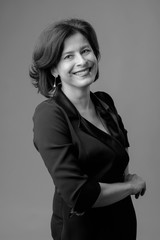 Portrait of happy businesswoman in black dress.